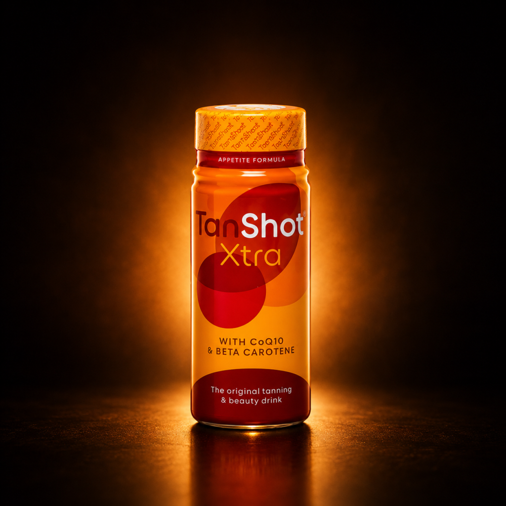 TanShot Xtra tanning drink bottle on dark bronze glow background
